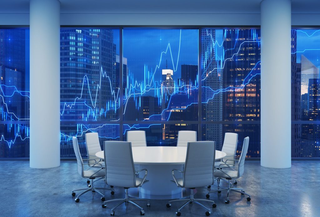 Conference room with modern chairs and a digital financial chart overlay.